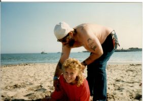 Beach revenge for Adria pouring sand down Eddie's plumber's crack Santa Cruz 