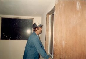 Eddie Carney building the master bedroom after prison release