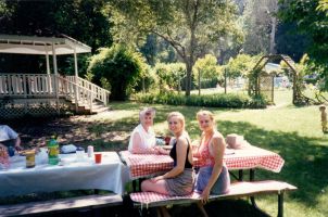 Adria, Janeane, and grandma Barbara Carney picnic at the pool
