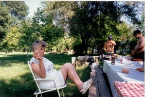 Eddie, Barbara, and Nick picnic in the park