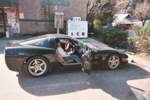 Terri, catching a ride in the Corvette