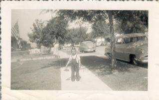 Shoes off in favorite overalls, on Coolidge St Long Beach